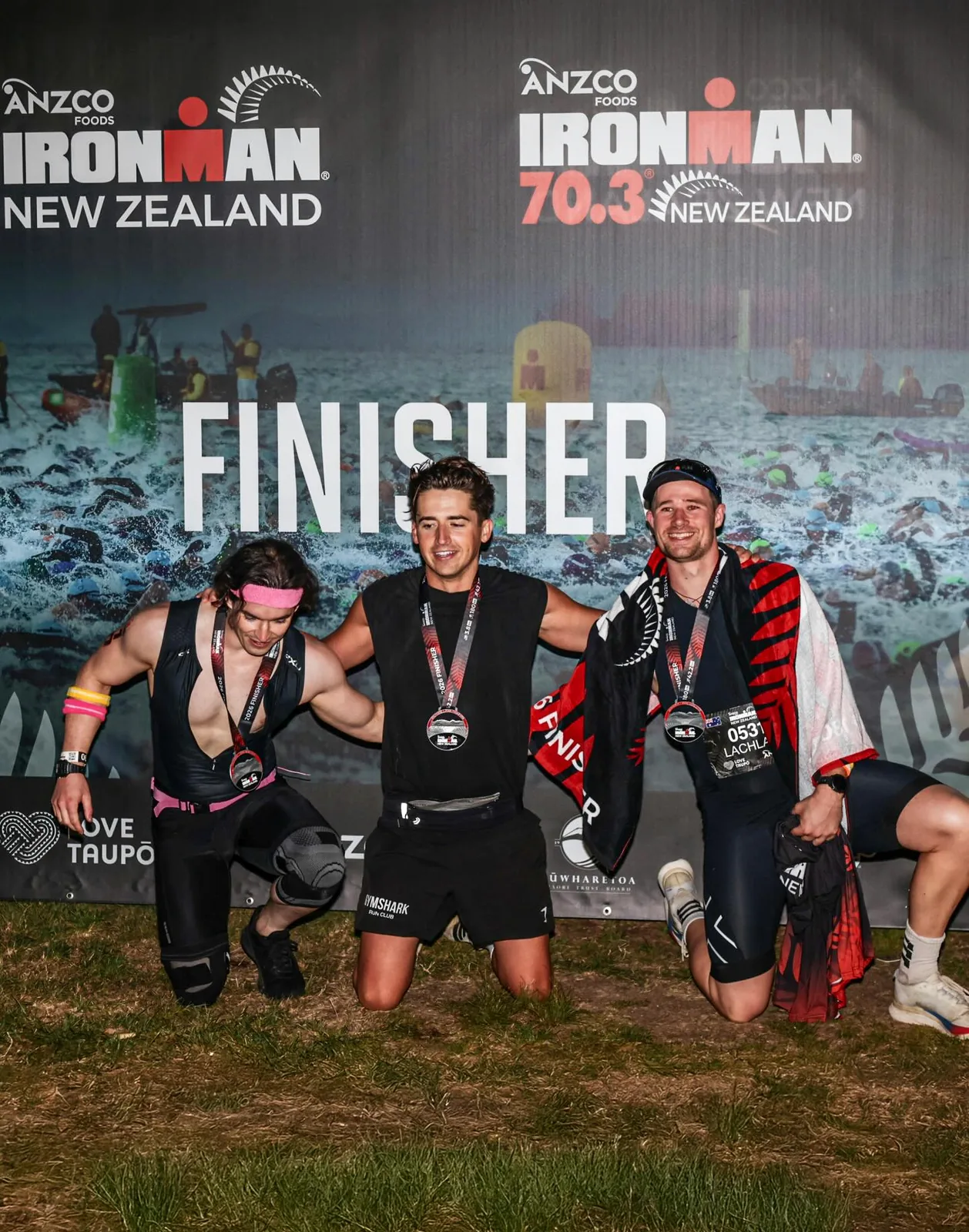 Jamin with Jordan and Lachlan at the Ironman New Zealand finisher wall